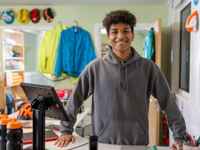Young man serving in shop