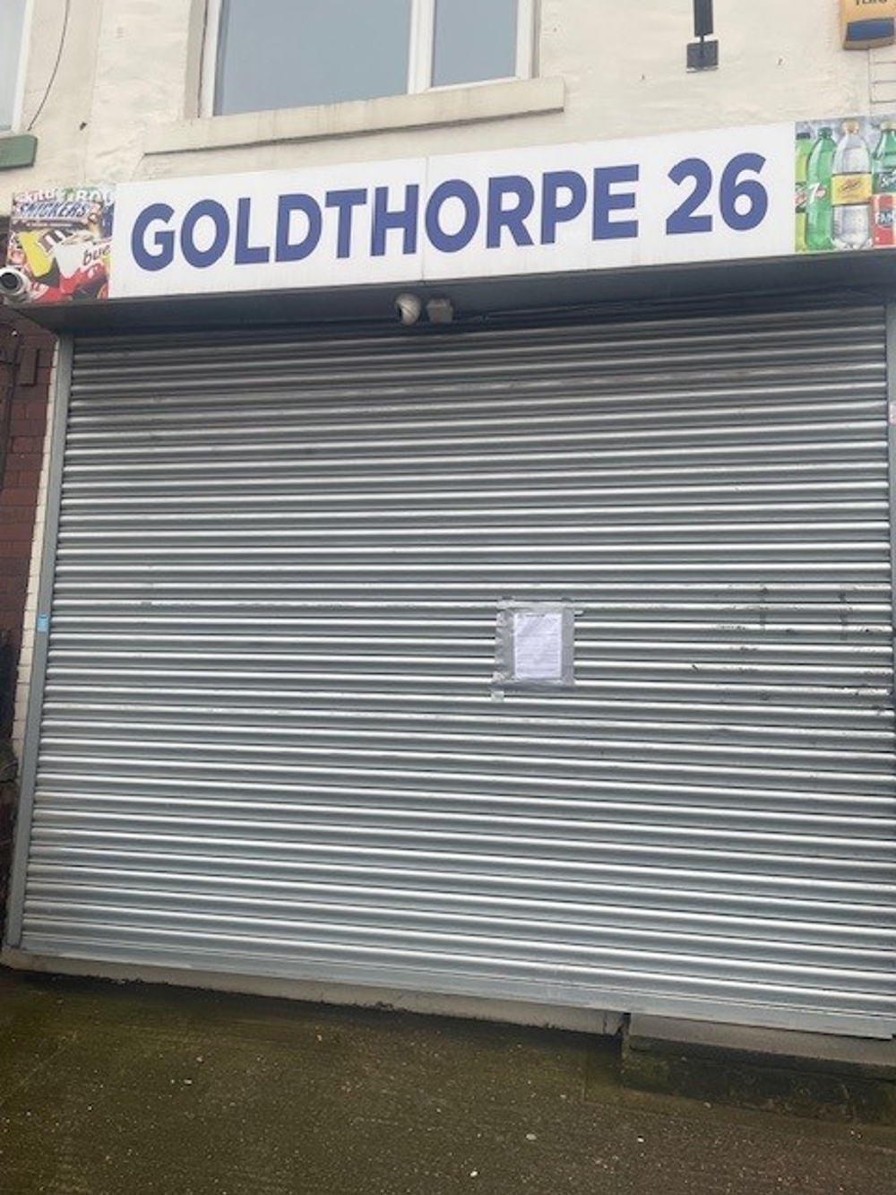 Closure notice on the shutters of Goldthorpe 26 convenience store