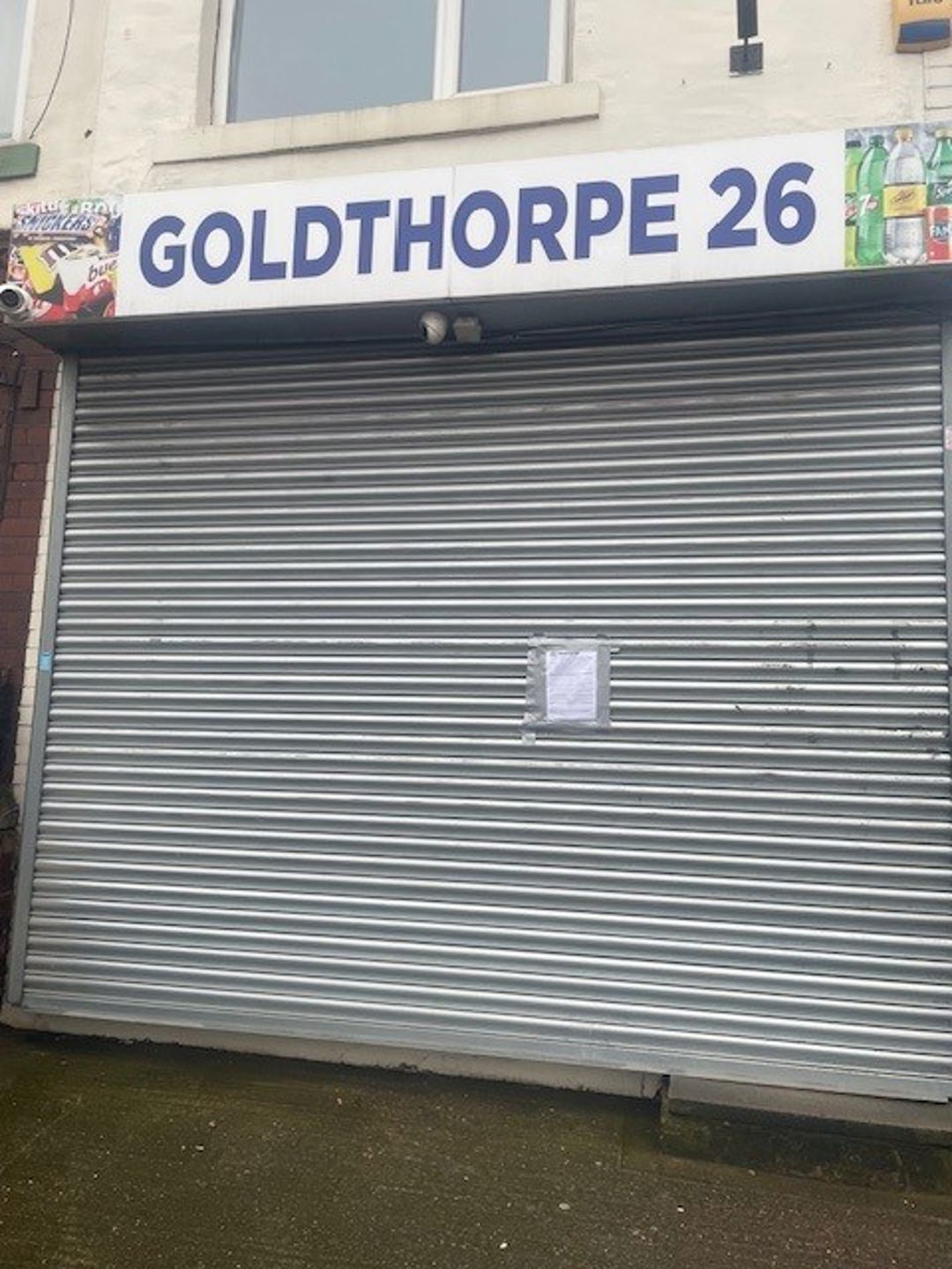 Closure notice on the shutters of Goldthorpe 26 convenience store