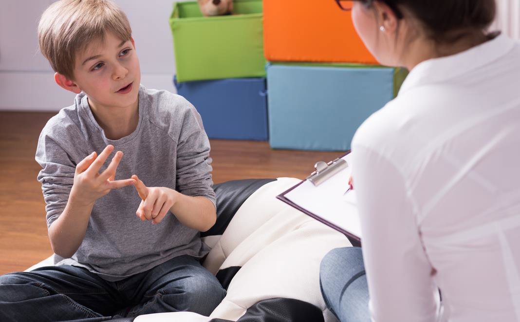 Social worker assessing boy