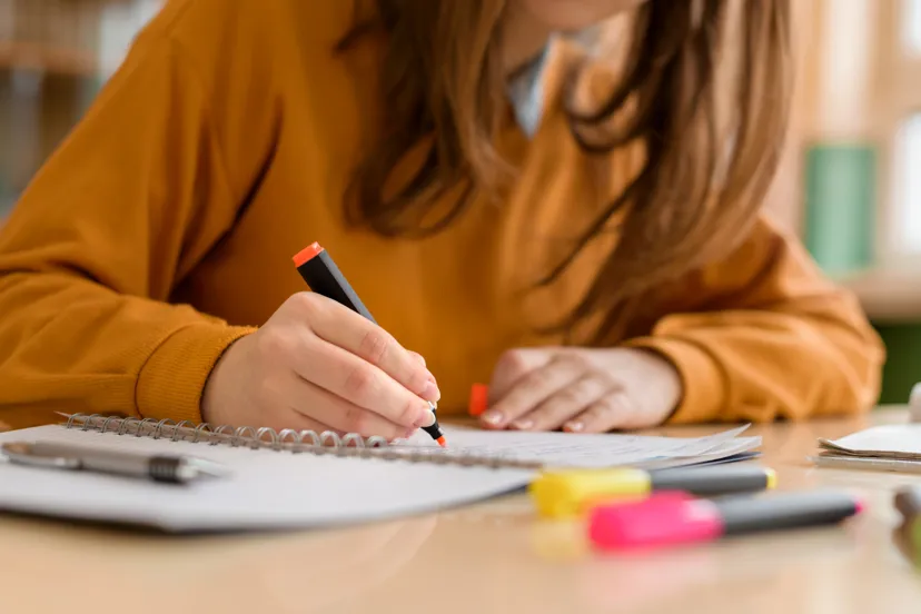 Young person making notes