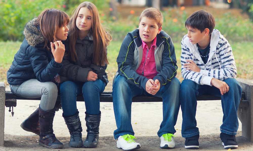 Children sat on a bench