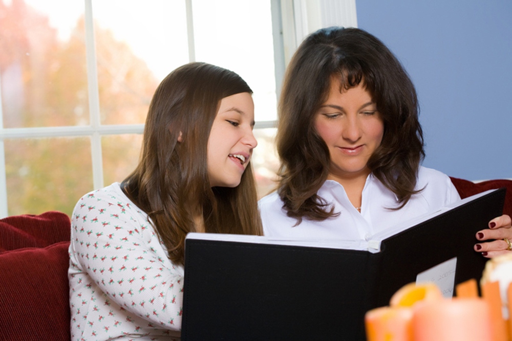 Girl looking at photo album