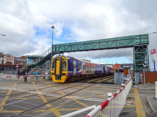 Jumble Lane with train passing over the level crossing
