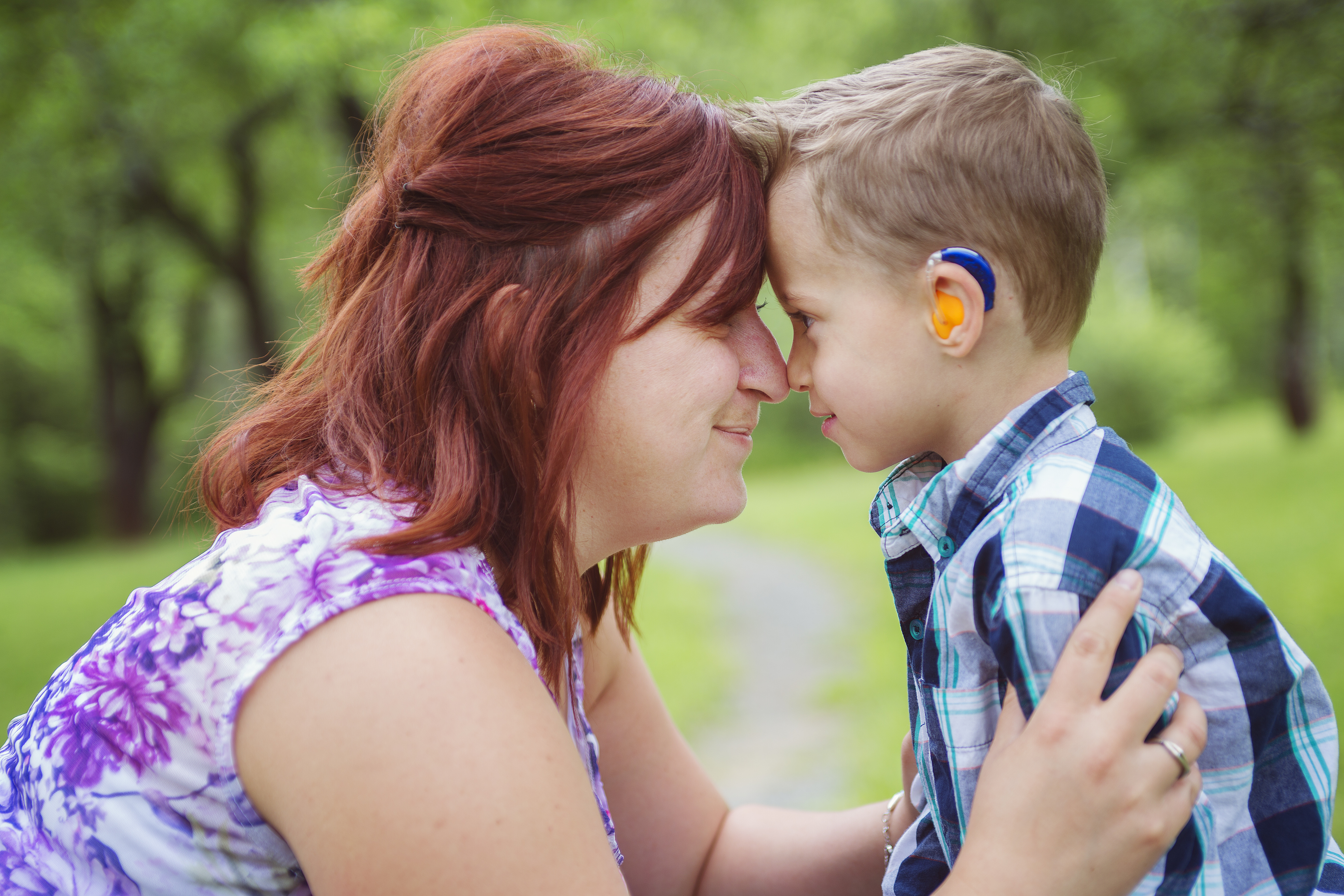 Mum and son looking at each other