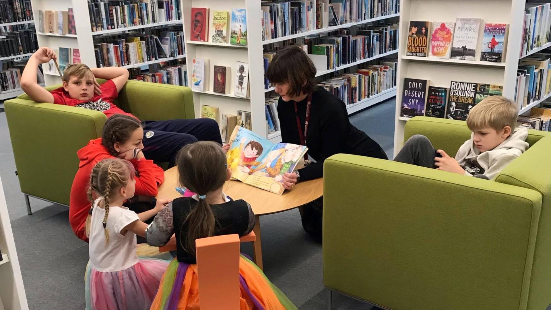Children reading in the Lightbox library