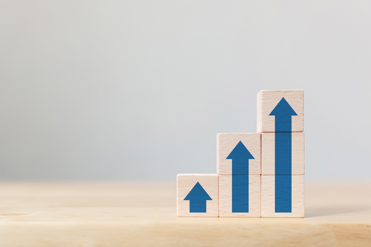 Wooden blocks with increasing arrows.jpg