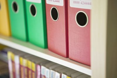 ring binders on a shelf