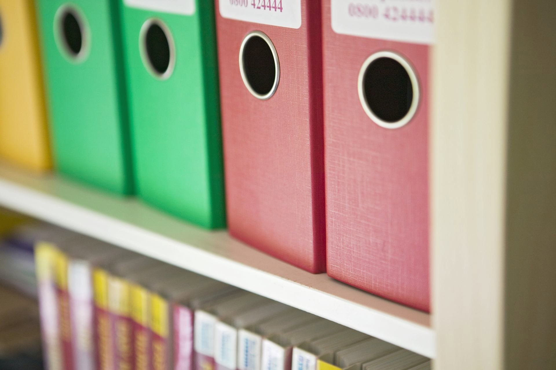 ring binders on a shelf