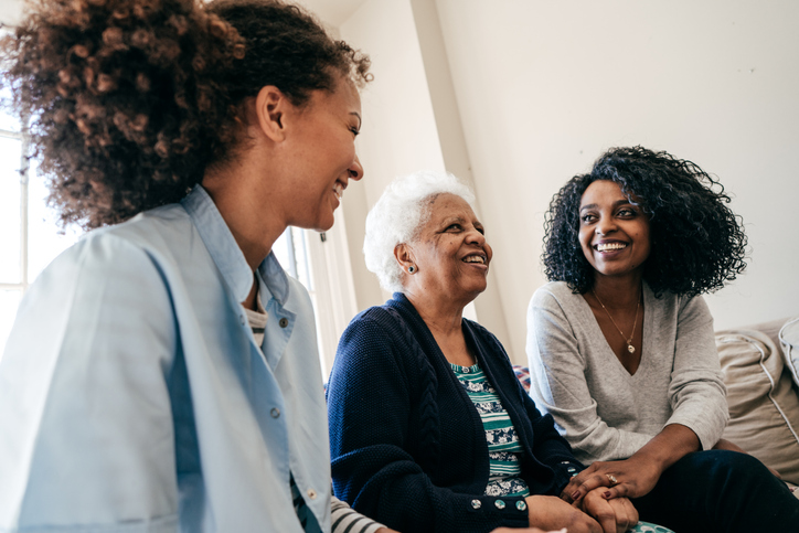 Two women caring for their mother