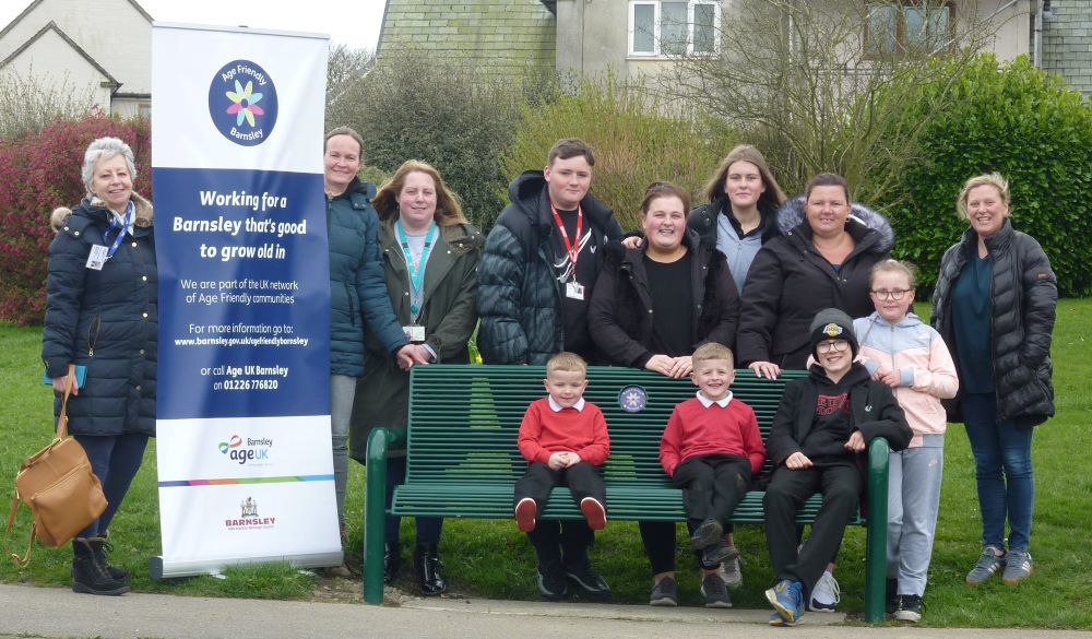 Staff and residents at the new Age Friendly Barnsley bench in Penistone
