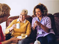 Care worker with care home residents