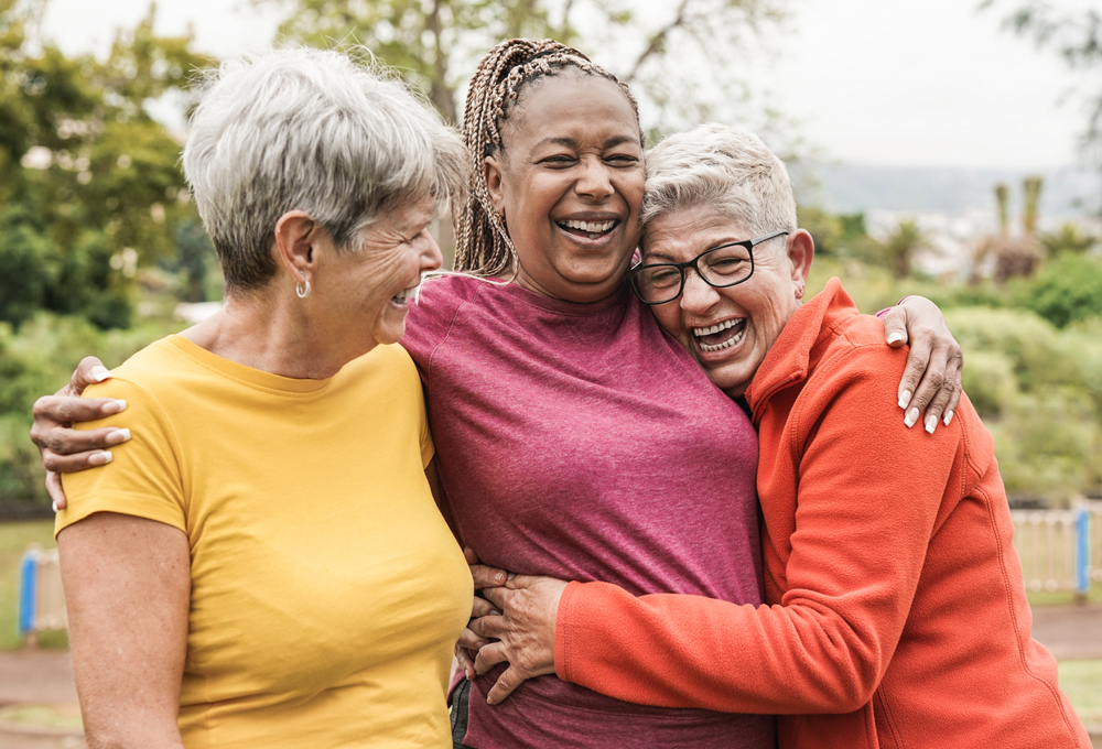 Group of three women smiling