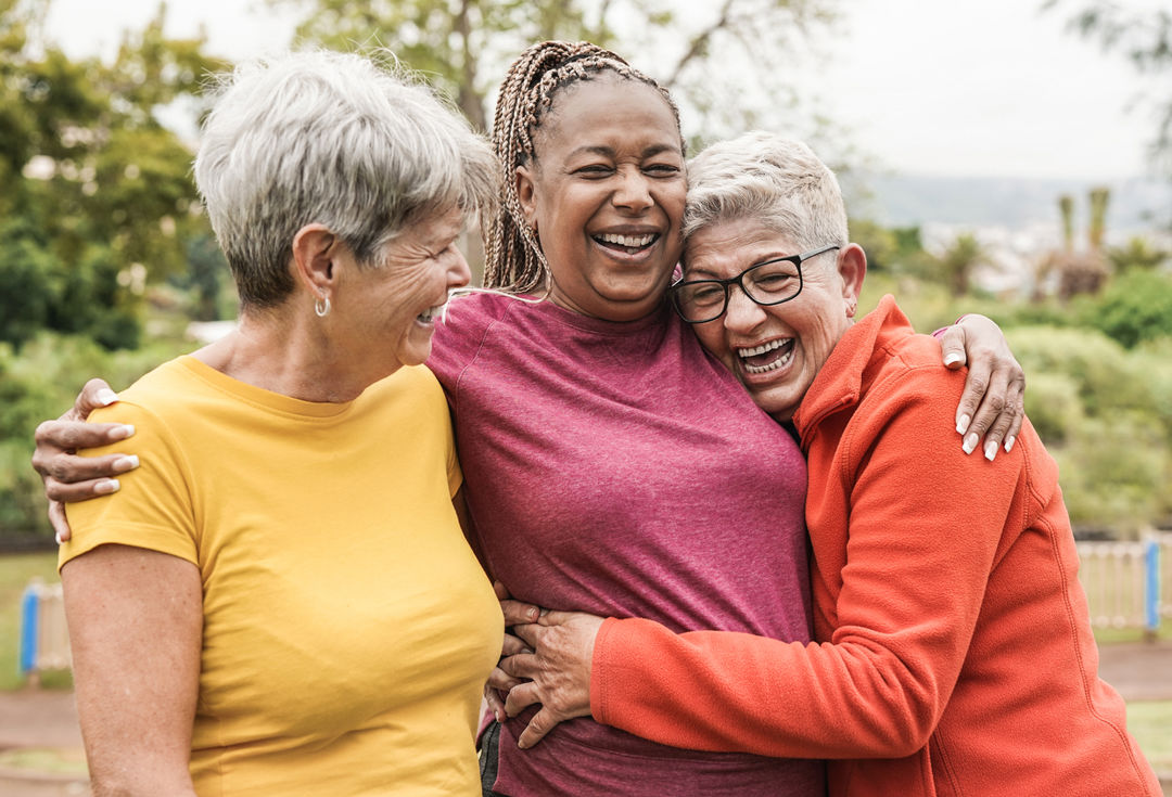 Group of three women smiling