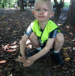 Child digging with stick