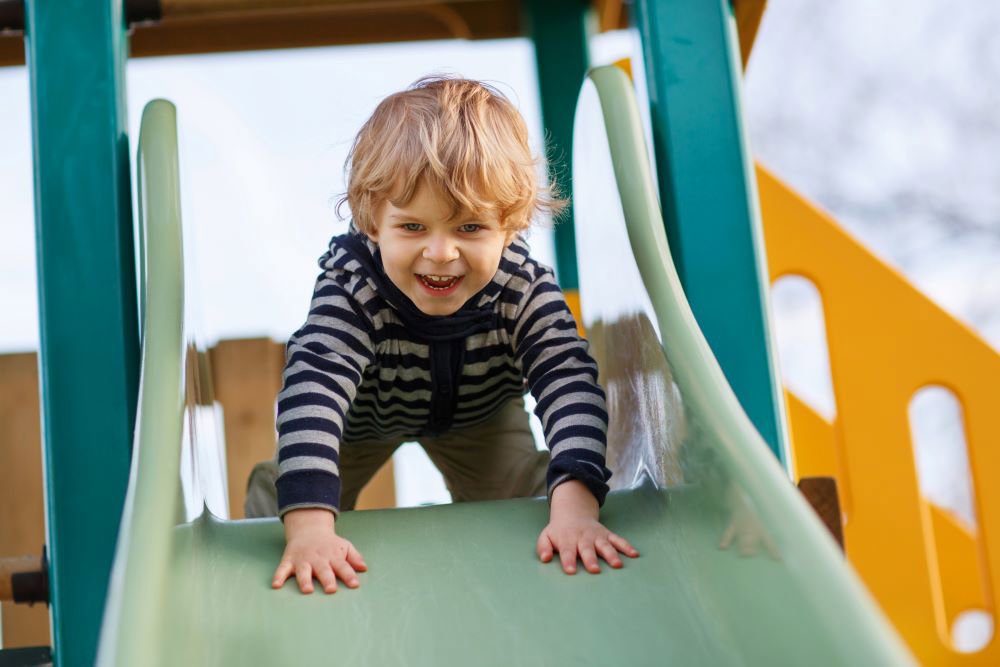 Toddler on slide