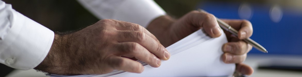 Person looking through papers