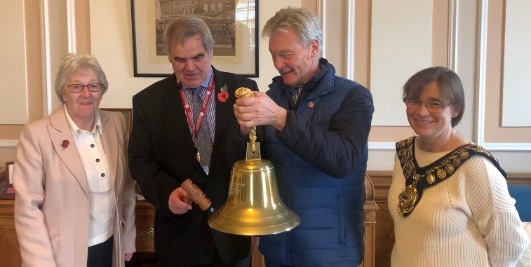 Cllr Clarke ringing the bell to celebrate his positive news..jpg