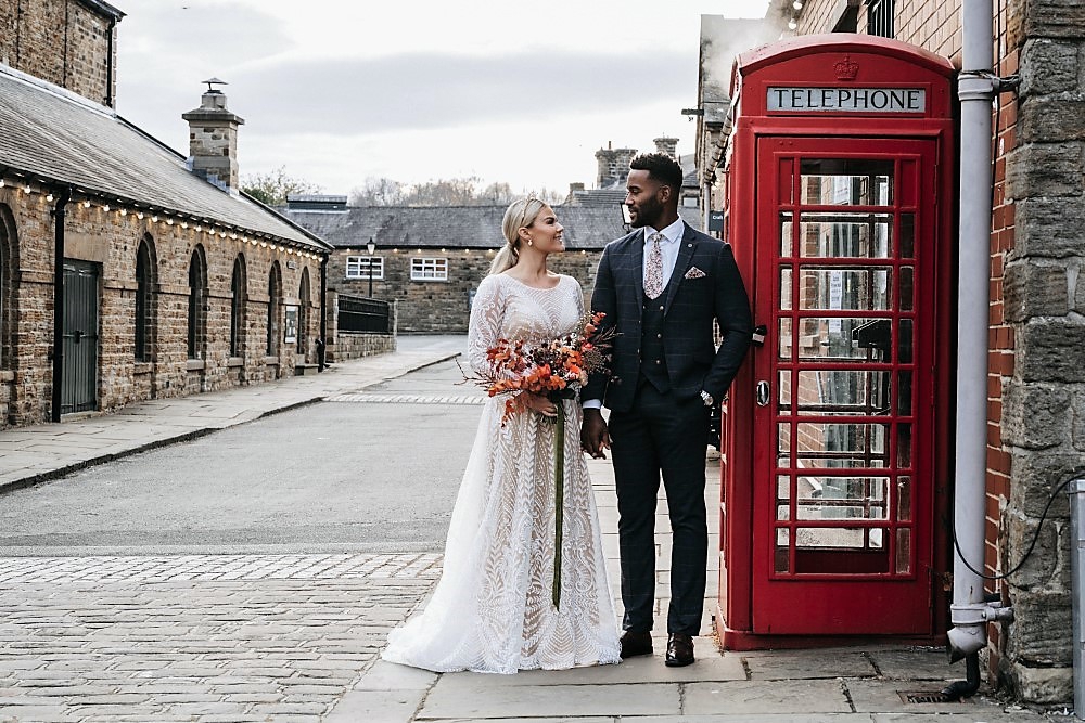 Couple next to phone box at Elsecar Heritage Centre