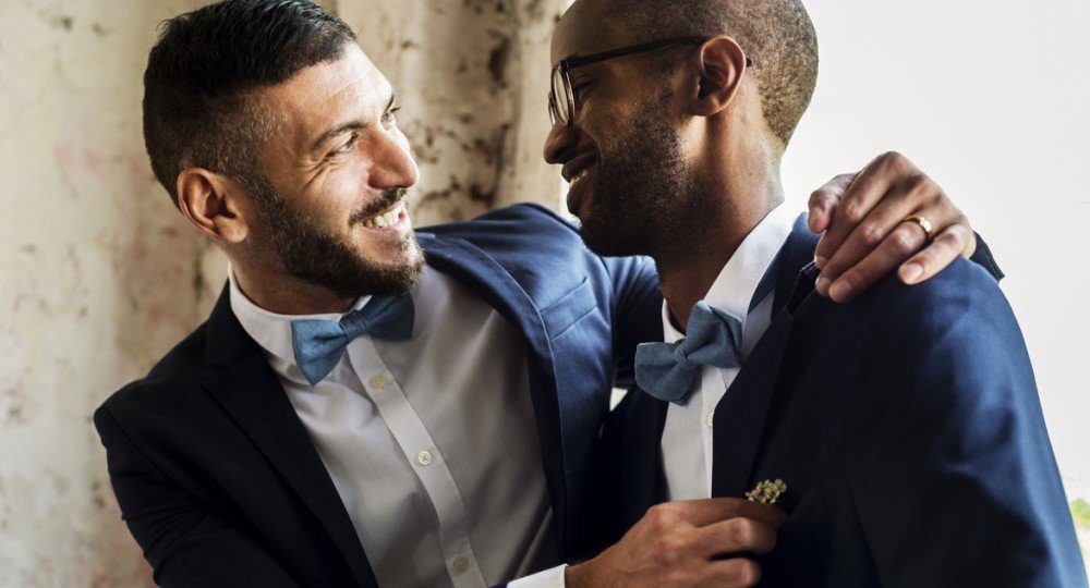 Grooms at civil partnership ceremony