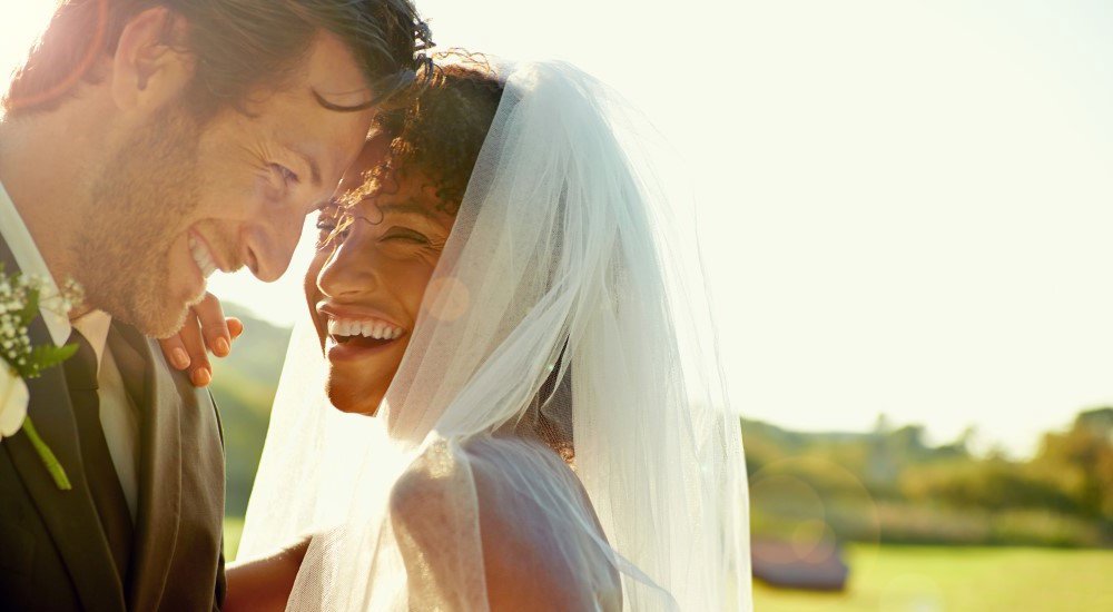 Couple smiling on their wedding day