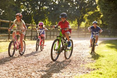 Children on bikes in a park