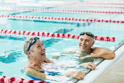 Older couple talking in a swimming pool