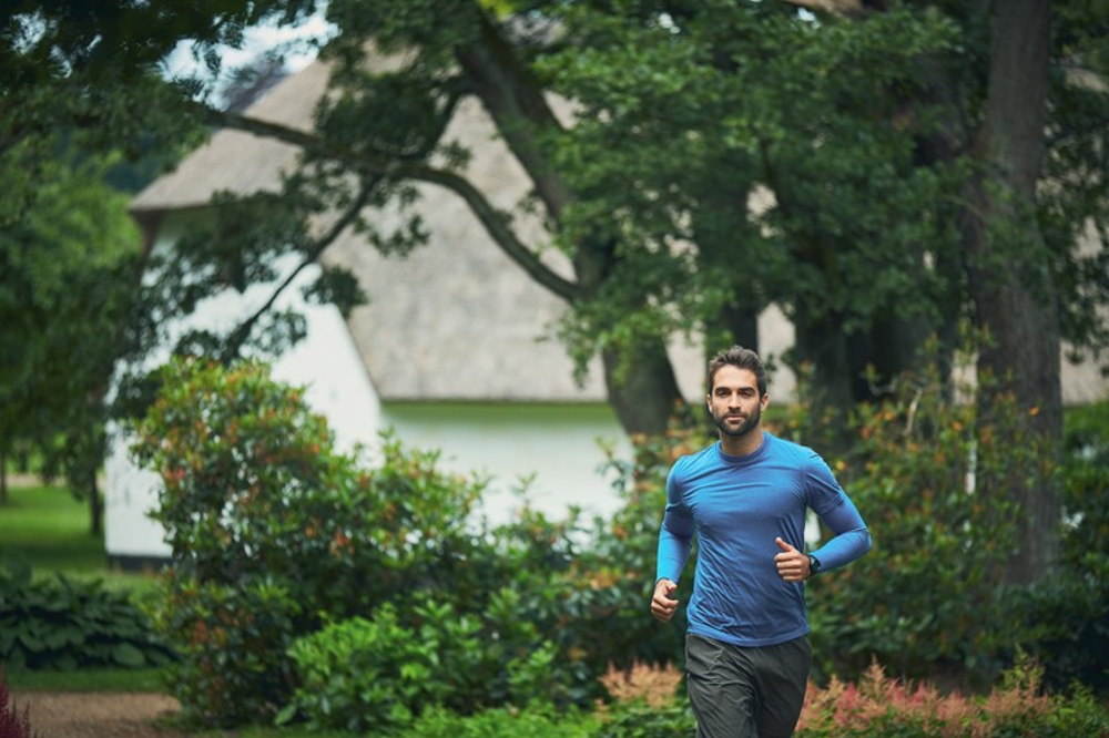 Man running through woods