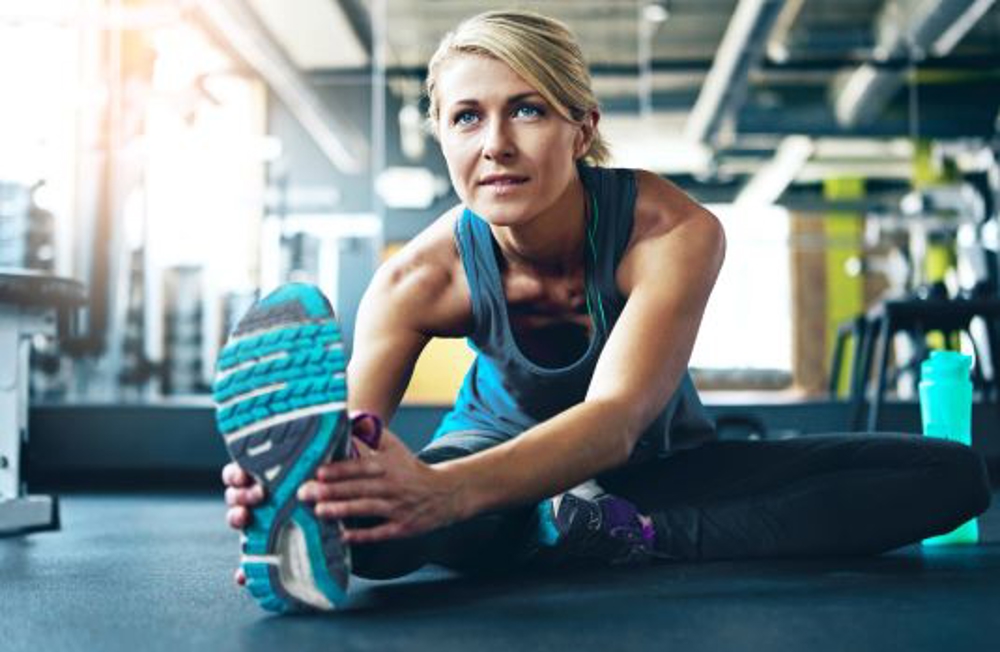 Woman stretching her leg before excercise