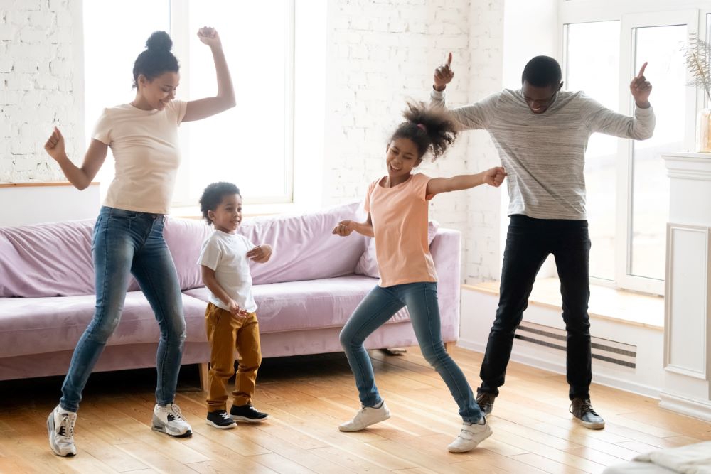 Parents dancing with 2 children