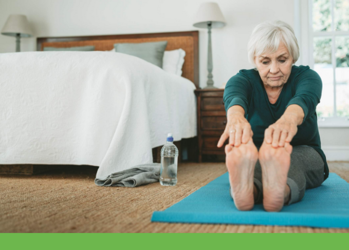 Older woman stretching on a yoga mat