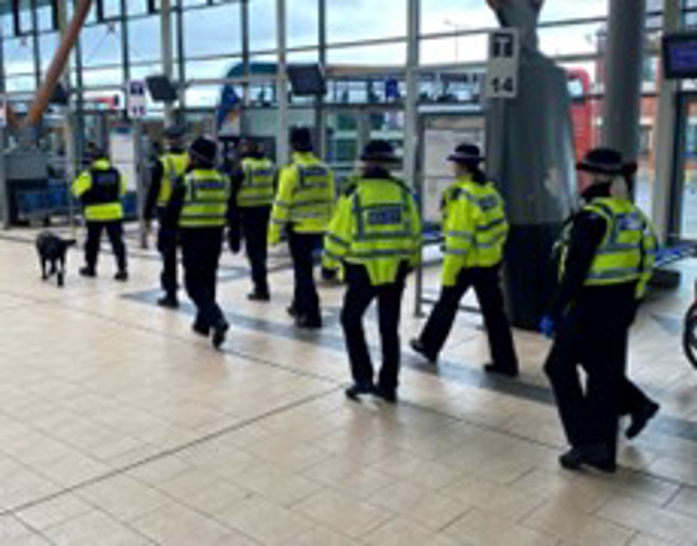 Officers walking in bus station