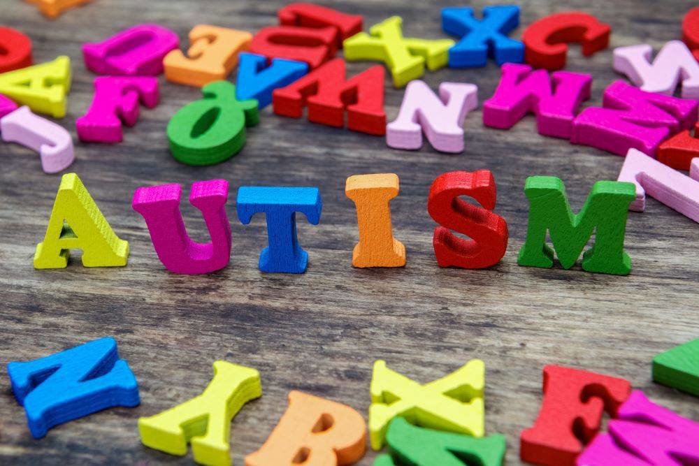 Autism written in coloured blocks