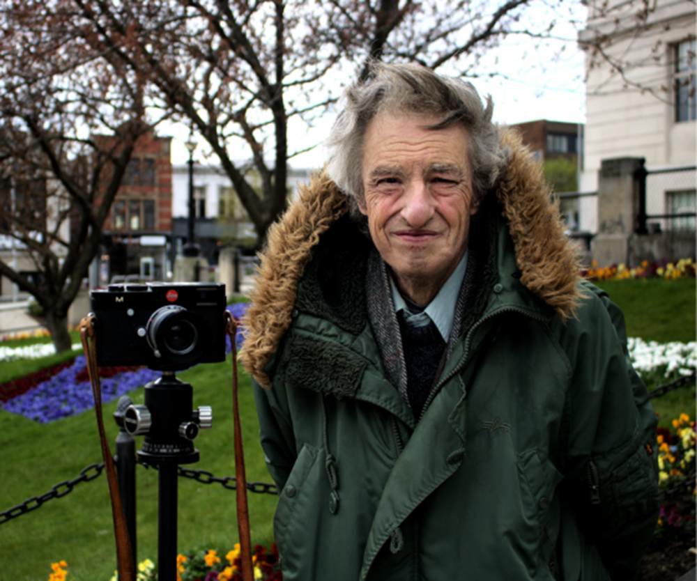 Martin with camera outside town hall