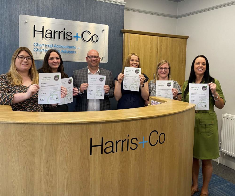 Accountants at Harris and Co with their certificates