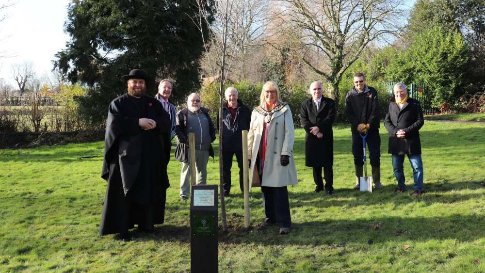 Group stood around new tree