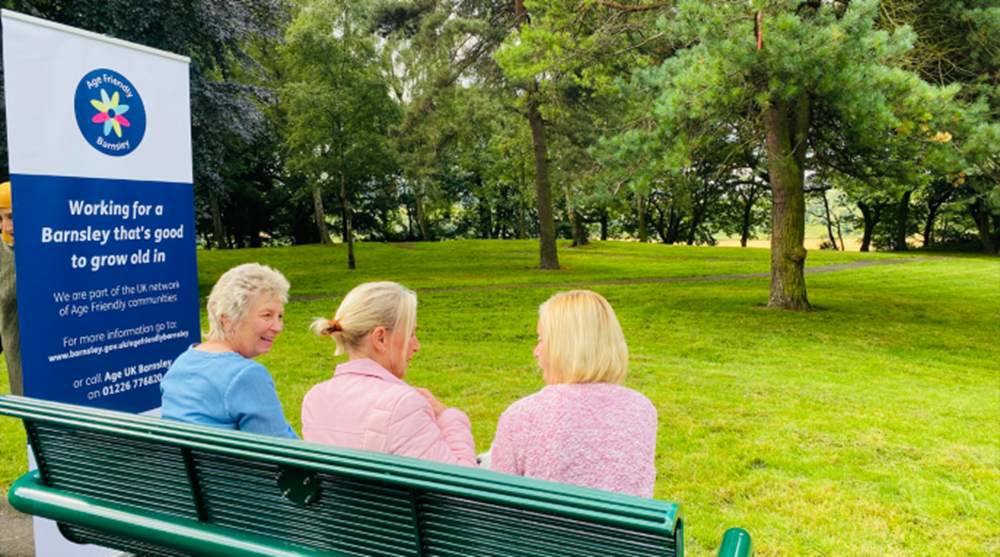 People sat on bench in park