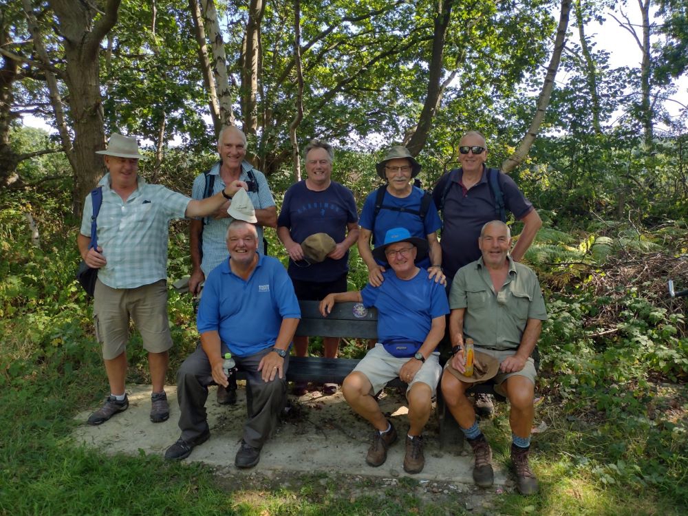 Group of men sat on a bench