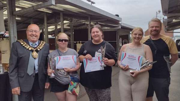 Photograph of young traders with the mayor