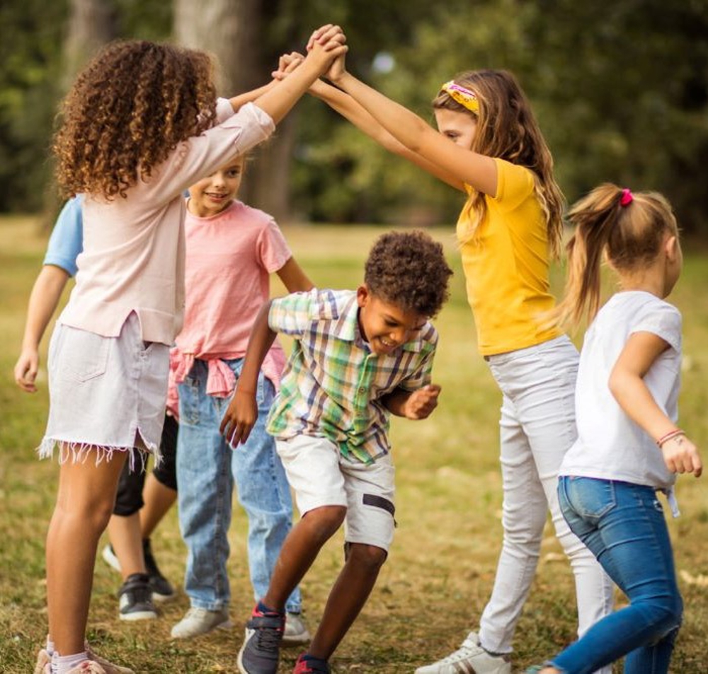 Children playing game on field
