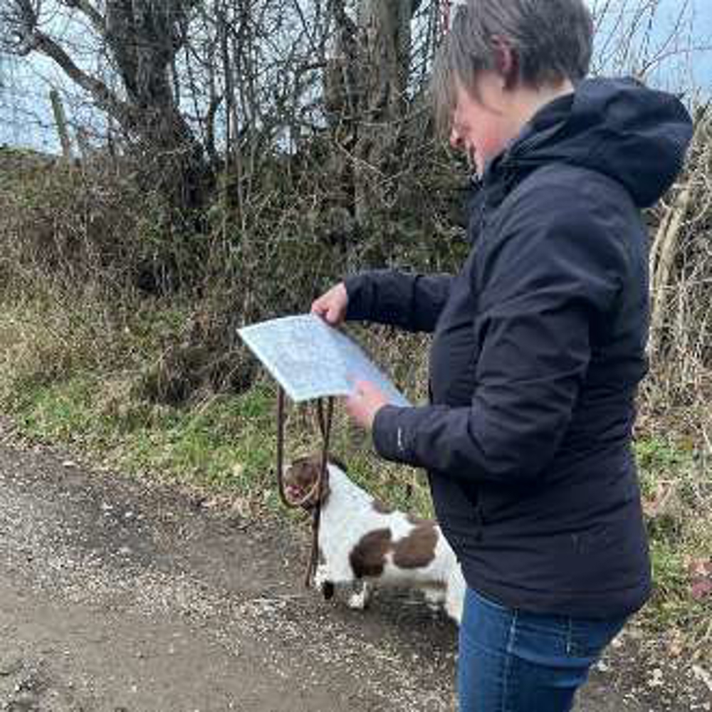 woman with map and dog