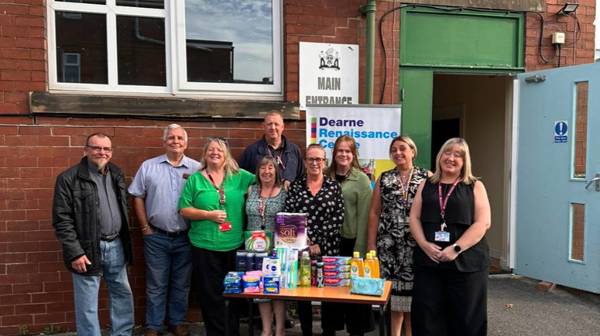 Photograph of those involved standing outside the Dearne hygiene bank