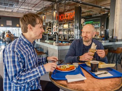 People sat eating in restaurant