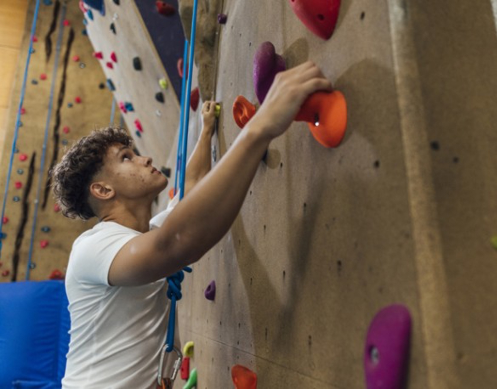 Young Person On Climbing Wall