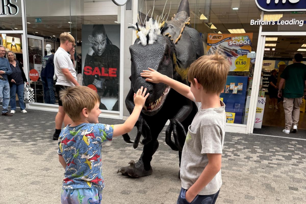 Children interacting with dinosaur.png Children interacting with dinosaur.png