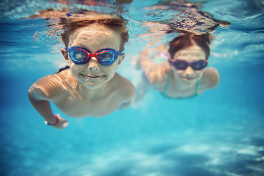 Children swimming under water
