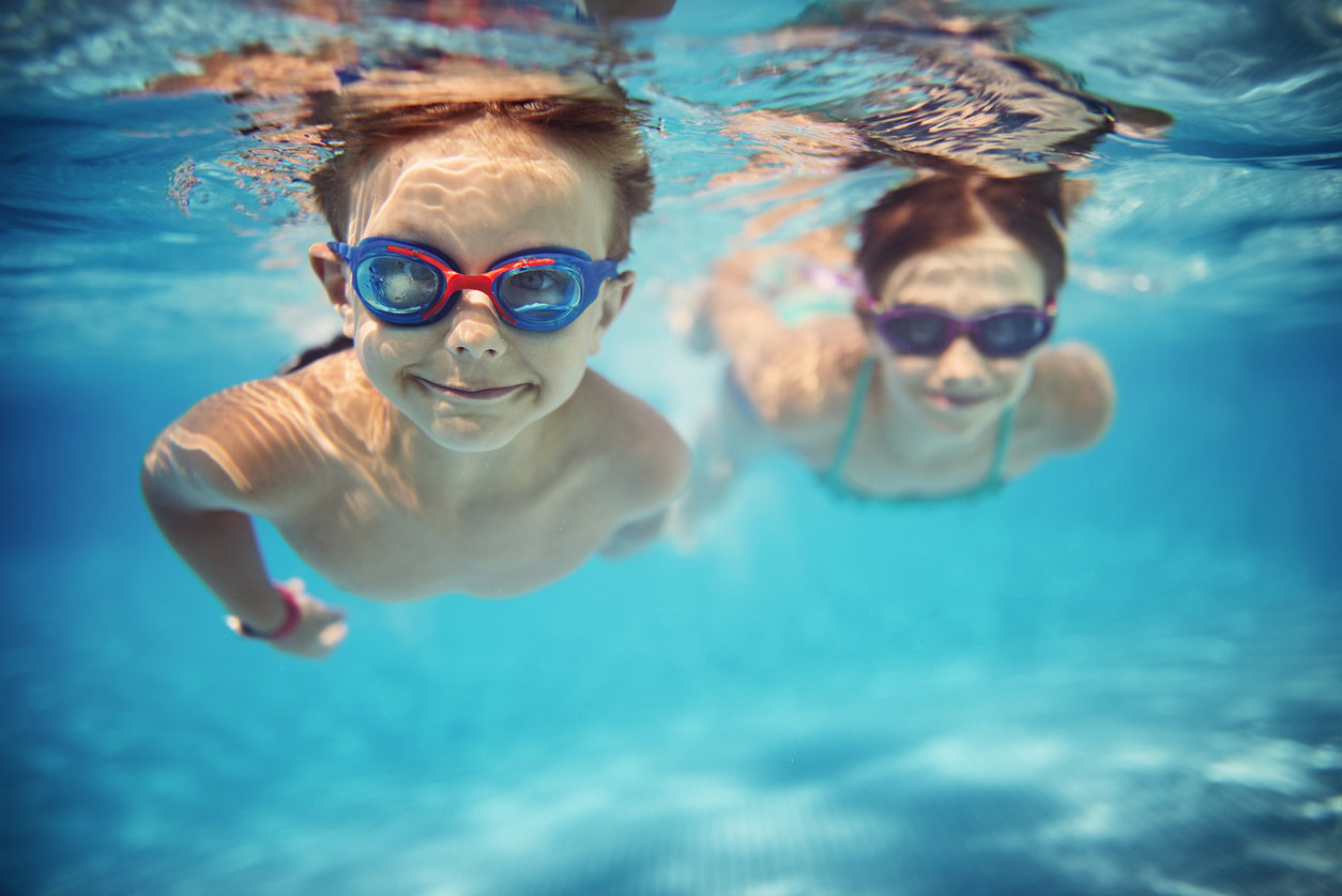 Children swimming under water