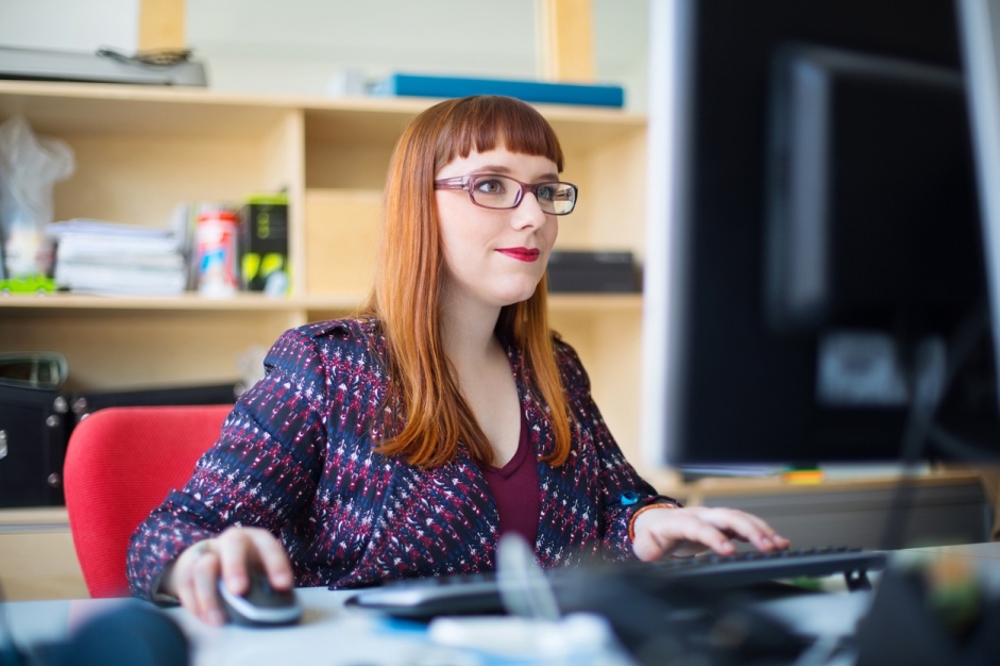 Young woman working on computer in an office