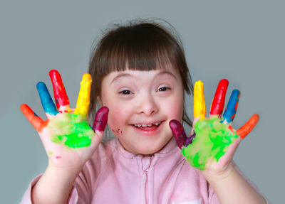 Girl with painted hands