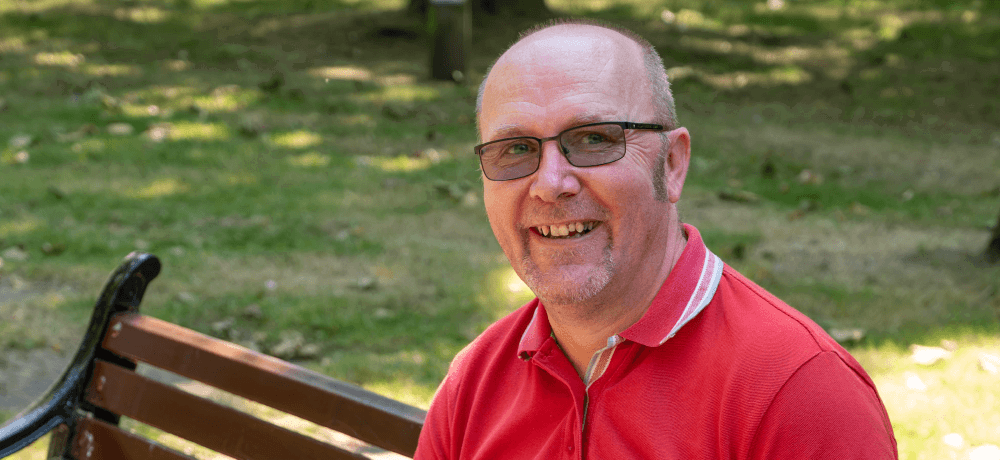 Man sat on a park bench